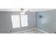 Bright bedroom with gray walls, ceiling fan, and wall-mounted TV bracket at 1139 Topp Creek Dr, Indianapolis, IN 46214