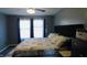 Bright bedroom featuring a comfortable bed with soft pillows, curtains, and dresser at 1139 Topp Creek Dr, Indianapolis, IN 46214