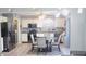 Charming kitchen area with modern lighting, stainless steel appliances, and a glass dining table at 1139 Topp Creek Dr, Indianapolis, IN 46214