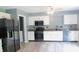 Modern kitchen features stainless steel appliances, granite countertops, and white cabinetry at 1139 Topp Creek Dr, Indianapolis, IN 46214