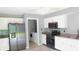 Modern kitchen features stainless steel appliances, granite countertops, and white cabinetry at 1139 Topp Creek Dr, Indianapolis, IN 46214