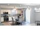 Charming kitchen area with modern lighting, stainless steel appliances, and a glass dining table at 1139 Topp Creek Dr, Indianapolis, IN 46214
