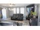 Cozy living room featuring plush seating, large windows, and stylish decor for comfortable relaxation at 1139 Topp Creek Dr, Indianapolis, IN 46214