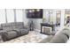 Spacious living room boasting modern furniture, a fireplace, and elegant decor, perfect for entertaining at 1139 Topp Creek Dr, Indianapolis, IN 46214
