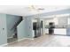 Open-concept living space connects staircase and kitchen, featuring modern gray flooring at 1139 Topp Creek Dr, Indianapolis, IN 46214