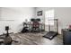 Well-lit home office with dual monitors, a treadmill, and a dedicated workspace for productivity at 11629 Brookwood Trace Ln, Indianapolis, IN 46229