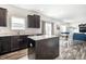 Open kitchen flows into the living and dining area, creating a cohesive and social living space at 11629 Brookwood Trace Ln, Indianapolis, IN 46229