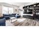 Comfortable living room with a large sectional sofa, modern TV console, and plenty of natural light at 11629 Brookwood Trace Ln, Indianapolis, IN 46229