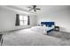 Spacious main bedroom with a tray ceiling, plush carpet, a large window and calming paint at 11629 Brookwood Trace Ln, Indianapolis, IN 46229