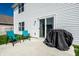 Back patio with patio furniture, grill and sliding glass door leading into the house at 11629 Brookwood Trace Ln, Indianapolis, IN 46229