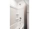 Shower with neutral shower curtain, white shower walls, and shower head at 11629 Brookwood Trace Ln, Indianapolis, IN 46229