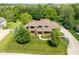 Aerial view of the home showing professionally landscaped yard and circular driveway at 13225 Gatman Ct, Carmel, IN 46032