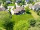 Backyard aerial view showcasing the patio with an outdoor table and chairs at 13225 Gatman Ct, Carmel, IN 46032