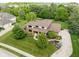Overhead view of large brick home surrounded by lush landscaping at 13225 Gatman Ct, Carmel, IN 46032
