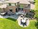 Paver patio with comfortable seating, grill, and hot tub, perfect for outdoor living at 13225 Gatman Ct, Carmel, IN 46032