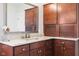 Bathroom vanity featuring granite countertops, wooden cabinets, and ample storage at 13225 Gatman Ct, Carmel, IN 46032