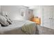 Serene bedroom with neutral tones, a cozy bed, natural light, and a built-in closet for ample storage at 13225 Gatman Ct, Carmel, IN 46032