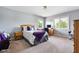Comfortable bedroom with carpet floors and a view of the trees from the windows at 13225 Gatman Ct, Carmel, IN 46032