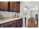 Kitchen countertop with wooden cabinets, granite countertops, and stainless steel appliances at 13225 Gatman Ct, Carmel, IN 46032