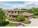 Beautiful two-story brick home featuring manicured landscaping and a two-car garage at 13225 Gatman Ct, Carmel, IN 46032