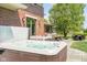 Backyard hot tub and patio provides a serene retreat for relaxation and outdoor enjoyment with seating at 13225 Gatman Ct, Carmel, IN 46032