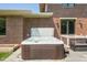 Backyard hot tub set in a landscaped patio area, offering a relaxing spa experience at 13225 Gatman Ct, Carmel, IN 46032