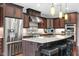 Close up of kitchen island and stainless steel appliances at 13225 Gatman Ct, Carmel, IN 46032