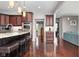 Open kitchen featuring a breakfast bar with granite countertops and stainless steel appliances at 13225 Gatman Ct, Carmel, IN 46032