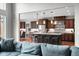 Open concept kitchen featuring a large island, stainless steel appliances, and hardwood floors at 13225 Gatman Ct, Carmel, IN 46032