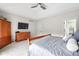 Main bedroom features carpet floors, TV, and a large closet with natural light at 13225 Gatman Ct, Carmel, IN 46032