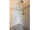 Tiled shower featuring stone accents, a shower head, and neutral tones at 13225 Gatman Ct, Carmel, IN 46032