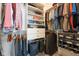 Organized walk-in closet with shelving, drawers, and hanging rods at 13225 Gatman Ct, Carmel, IN 46032