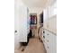 Walk-in closet with custom shelving, drawers, and ample storage space at 13225 Gatman Ct, Carmel, IN 46032