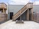 A cozy backyard area featuring a fire pit, wooden stairs, and a mix of stone and grass at 1326 E 10Th St, Indianapolis, IN 46202