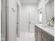 Bright bathroom with double sink vanity, quartz countertop, and modern fixtures at 1326 E 10Th St, Indianapolis, IN 46202