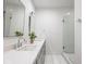 Modern bathroom with double vanity, stylish faucets, and a glass-enclosed shower at 1326 E 10Th St, Indianapolis, IN 46202