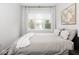 Comfortable bedroom with neutral decor, large windows, and great natural light at 1326 E 10Th St, Indianapolis, IN 46202