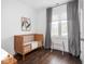Cozy Bedroom featuring wood floors, a wooden crib, and neutral decor at 1326 E 10Th St, Indianapolis, IN 46202
