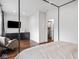Bedroom featuring hardwood floors and a walk-in closet at 1326 E 10Th St, Indianapolis, IN 46202