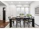 Charming dining area featuring a window and a large table with seating for six at 1326 E 10Th St, Indianapolis, IN 46202