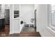 Chic entryway with built-in bench, coat hooks, and stylish herringbone tile flooring at 1326 E 10Th St, Indianapolis, IN 46202