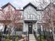 Stylish townhome with a black iron fence and landscaped yard at 1326 E 10Th St, Indianapolis, IN 46202