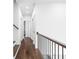 Hallway with hardwood floors and a stair railing at 1326 E 10Th St, Indianapolis, IN 46202
