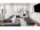 Bright living room featuring modern furniture, hardwood floors, and plenty of natural light at 1326 E 10Th St, Indianapolis, IN 46202