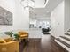 Open-concept living area with hardwood floors, high ceilings, and modern decor at 1326 E 10Th St, Indianapolis, IN 46202