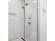 Modern shower features dual shower heads, white subway tile, and a frameless glass door at 1326 E 10Th St, Indianapolis, IN 46202