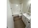 The bathroom boasts new fixtures, an updated vanity, and a shower-tub combo at 1348 Secretariat Ln, Indianapolis, IN 46217
