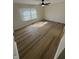 Bright bedroom with modern flooring, large window, and ceiling fan at 1348 Secretariat Ln, Indianapolis, IN 46217