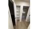 This hallway features fresh paint, modern flooring and a storage closet at 1348 Secretariat Ln, Indianapolis, IN 46217