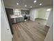 Stylish kitchen with stainless steel appliances, gray cabinets, light countertops, and modern flooring at 1348 Secretariat Ln, Indianapolis, IN 46217